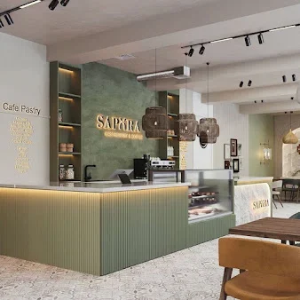 Sapora salonunda yaşıl piştaxta, işıqlı məkan adı və hörmə asma işıqlar